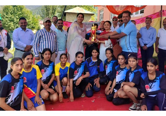 Winning team posing with trophy and dignitaries at Bhaderwah.