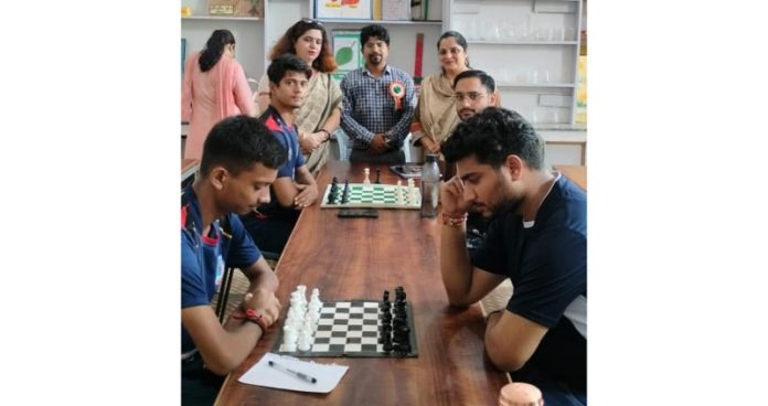 Players displaying keen interest during Inter-College Chess tournament at Jammu.