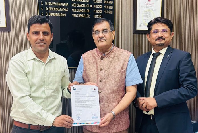 Former Indian footballer Arun Malhotra receiving appointment letter from VC Uttarakhand University.