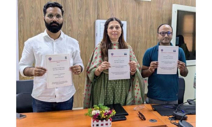 Principal of GDC Samba and others display copies of MoU with Social Welfare Department and IMCSD.