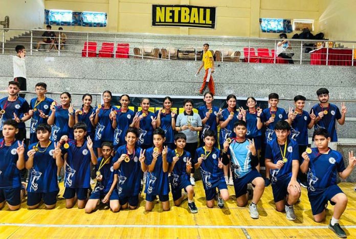 Netball players of KCPS posing along with medals.