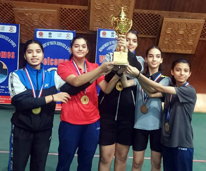 Winning team posing with trophy in Srinagar.