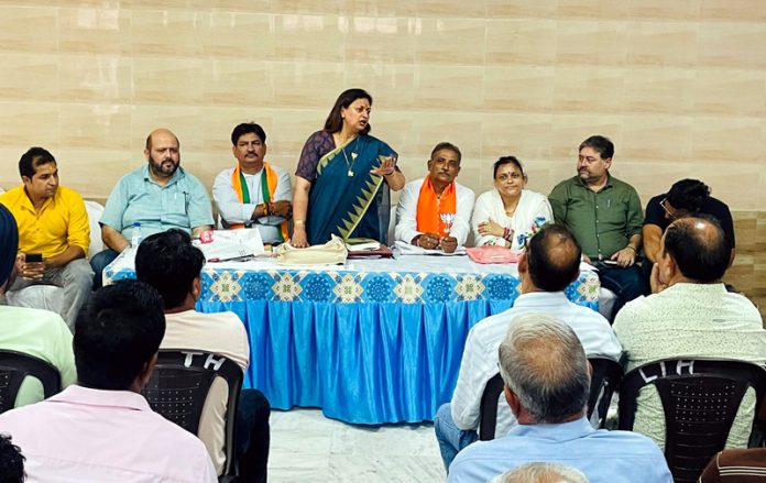 BJP district president Jammu South, Rekha Mahajan addressing a party meeting in Jammu on Tuesday.