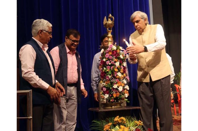 Chief guest lighting ceremonial lamp during inaugural of JU Foundation Day celebration function on Thursday. -Excelsior/Rakesh