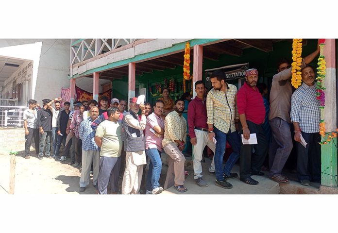 Voters in queue outside a Polling Station in Doda district to cast their vote. -Excelsior/Rafi Choudhary