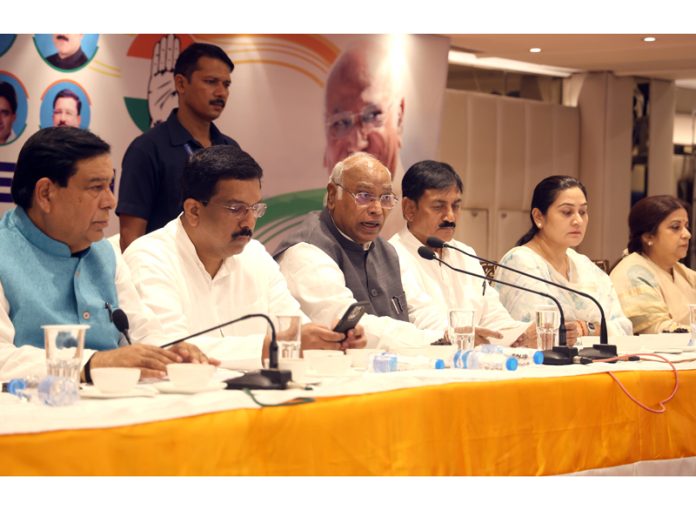 AICC president, Mallikarjun Kharge flanked by AICC gen secy Bharatsinh Solanki and CWC member Nasir Hussain, addressing press conference in Jammu. -Excelsior/Rakesh