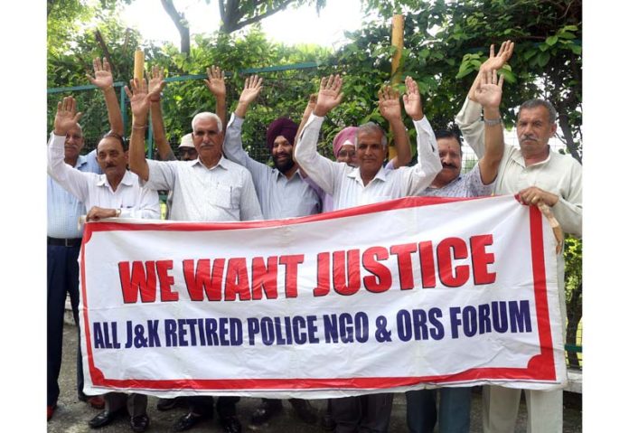 Retired personnel of J&K Police staging a protest near Hari Singh Park in Jammu. -Excelsior/Rakesh