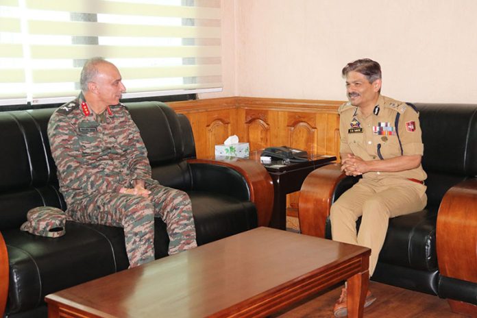 Lt Gen Rajiv Ghai interacting with DGP RR Swain in Srinagar on Friday.