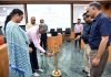 Chief guest lighting ceremonial lamp at inaugural of Capacity Building Program for Finance and Planning officials at IIM Jammu.