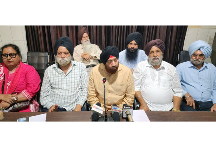 Sikh United Front Chairman, Sudershan Singh Wazir addressing press conference in Jammu. -Excelsior/Rakesh