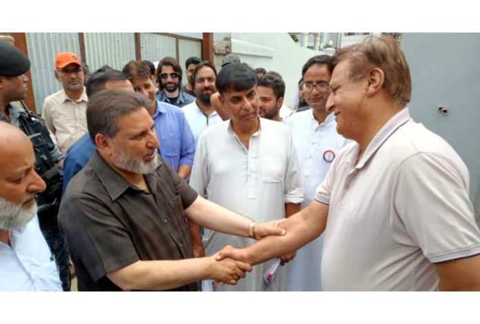 Apni Party President, Altaf Bukhari interacting with people during his campaign in Srinagar on Friday.