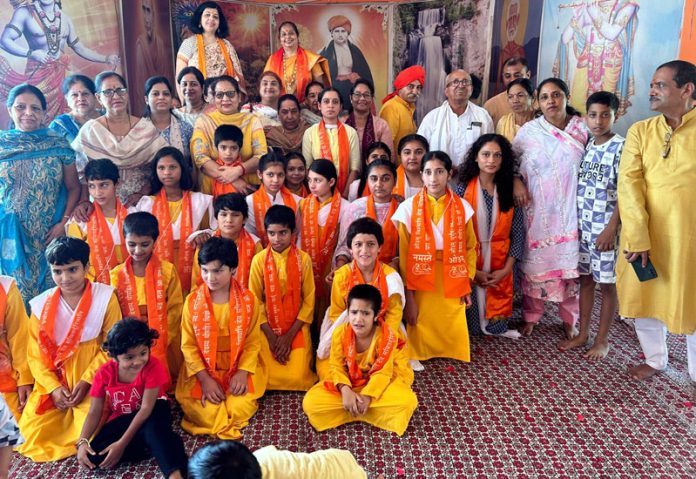 Girls and others during a ceremony at Kanya Gurukul in Udhampur on Monday.