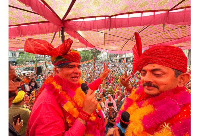 BJP president, Ravinder Raina and party candidate for Udhampur East, R S Pathania at an election rally on Sunday.