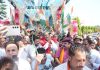 Cong candidate Mula Ram along with his supporters during a rally in Jammu on Sunday.