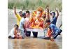 Devotees performing immersion of Lord Ganesha idol on conclusion of Ganesh Chaturthi celebrations on Tuesday. -Excelsior/Rakesh