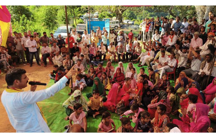 Independent candidate from Udhampur East, Pawan Khajuria addressing an election meeting on Friday.