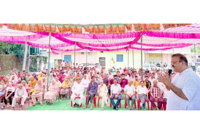 Senior BJP leader, Chander Prakash Ganga addressing an election meeting in Vijaypur Assembly constituency.