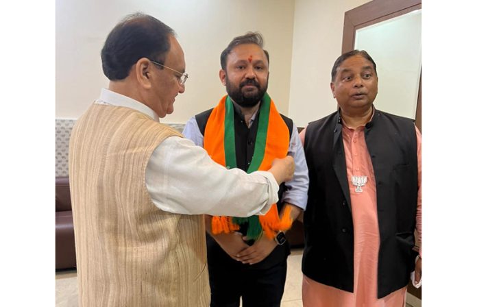 BJP National President JP Nadda welcoming Ankur Sharma into the party fold in Jammu on Sunday.