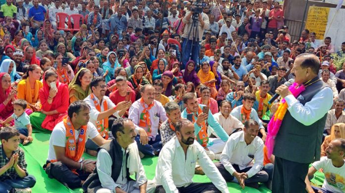 Union Minister Dr Jitendra Singh addressing BJP election public meeting at far-flung Duggan area of Bani Assembly constituency on Monday.