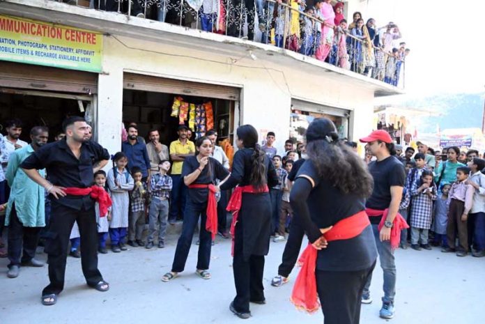 A scene from Nukkad Natak 'Vote Kareingey Hum' being staged in Ramban on Monday.