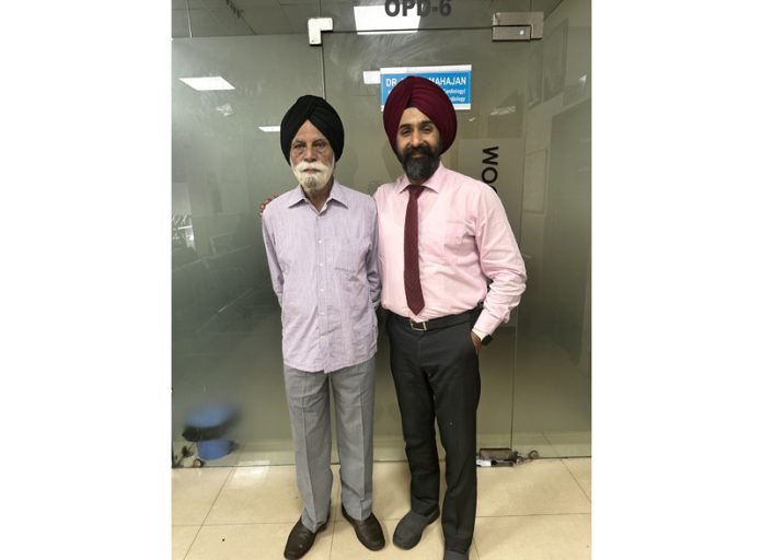 Dr Ranjit Singh posing with a patient on whom he performed knee replacement surgery.