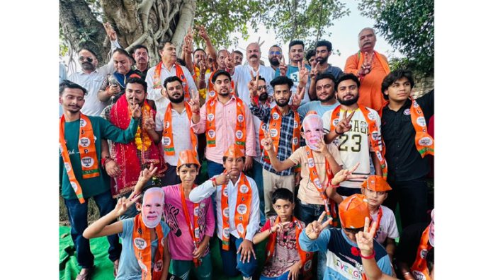 BJP's contesting candidate for Jammu East Constituency, Yudhvir Sethi with new entrants of the party at Sidhra, Jammu.