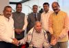 Team members of Anuvrat Vishva Bharati posing for a photograph with noted industrialist and philanthropist Ratan Tata in Mumbai.