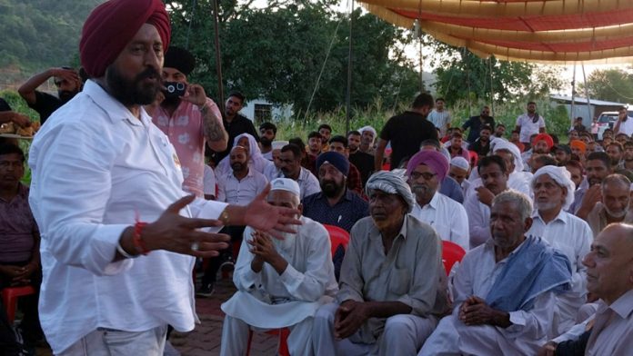 Cong leader Taranjit Singh Tony addressing a public meeting in Jammu on Tuesday.