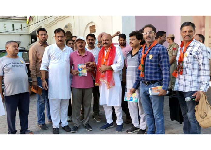 BJP candidate, Yudhvir Sethi during door-to-door campaign in Jammu East on Friday