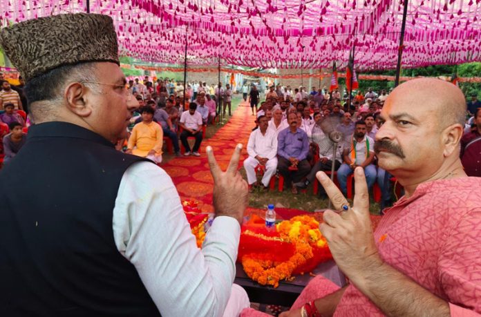 BJP leaders Ghulam Ali Khatana and Yudhvir Sethi during a party rally in Jammu East constituency on Tuesday.