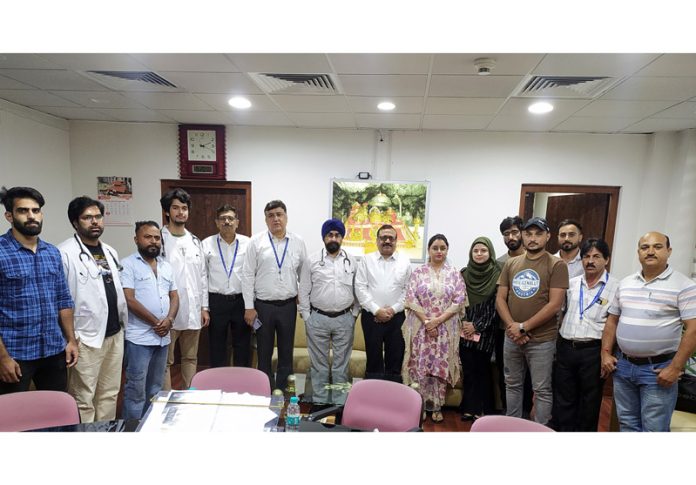 Dignitaries posing for a group photograph at Jammu Airport during a health camp on Friday.