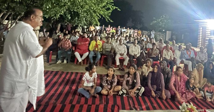 Chander Parkash Ganga addressing a public meeting on Wednesday.