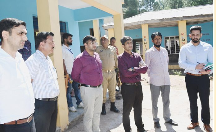 General Observer and DEO Rajouri inspecting polling station near LoC in Rajouri on Thursday.