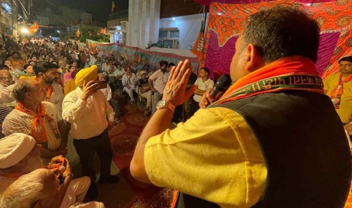 BJP leader Vikram Randhawa addressing a gathering in Bahu Assembly constituency on Saturday.