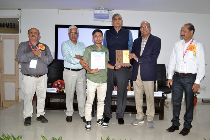 JU Vice-Chancellor and others releasing souvenir during inaugural of national seminar.