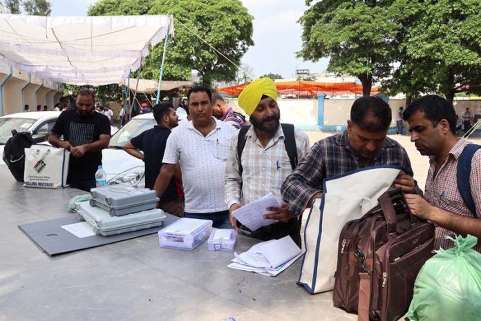 Polling staff collecting EVMs and other material in Jammu on Monday. -Excelsior/Rakesh